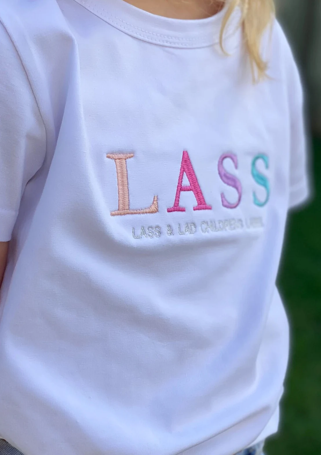 Embroidered LASS T-shirt detail